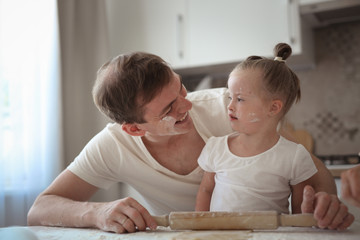 Caucasian dad and daughter with down syndrome