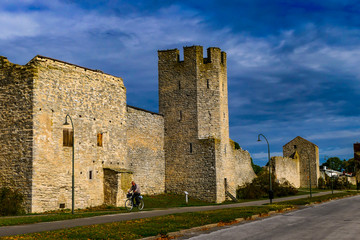 Fototapeta na wymiar Visby, Gotland, Sweden The Visby City defensive Wall with crenellations from the 12th century and pedestrians.