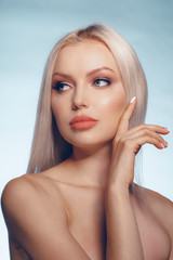 Close up beauty portrait of a blonde woman with perfect skin and plump lips