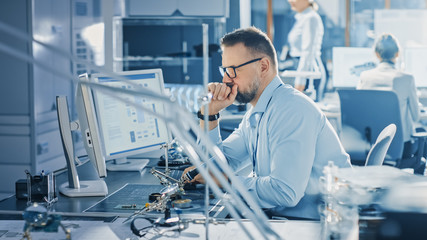 Electronics Development Engineer Working on Computer, Designing Motherboard, Doing Maintenance of...