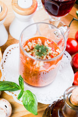 Tomato soup with fresh ingredients in a soup cup