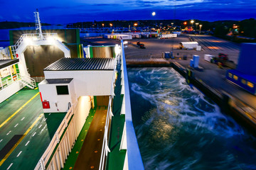 Nynashamn, Sweden A Baltic Sea ferry to the island of Gotland leaves the dock. in the evening.