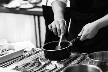 chef preparing food, chef cooking in a kitchen, chef at work, Black & White
