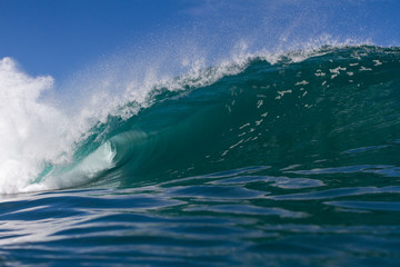 Fototapeta na wymiar Huge wave breaking on a reef in the ocean