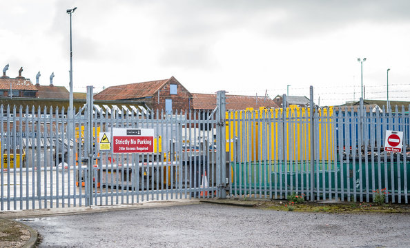 Great Yarmouth, Norfolk, UK – September 08 2019. Metal security fence around the perimeter of an industrial unit in the Southtown Road region of Great Yarmouth and the “No entry” gate