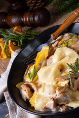 Colorful farfalle pasta with chanterelles and cream sauce.