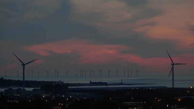 Sunset over Burbo Bank Offshore Windfarm Turbines in Liverpool Bay
