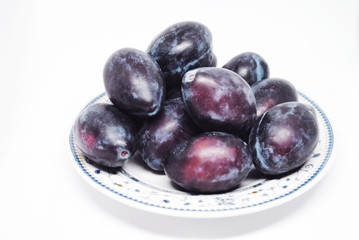 The  plate with blue plums (harvest)