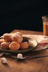 Small donuts with powdered sugar selective focus