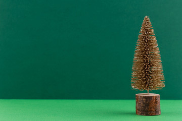 Christmas tree on pastel colored background. Christmas or New Year minimal concept.