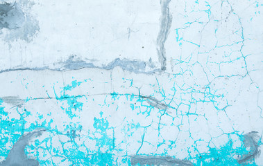 White wall with cracks and stains of old paint. Image for background.