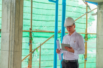Civil engineer is inspecting in building site