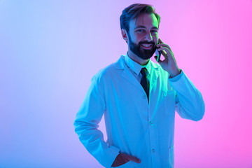 Portrait of a confident young man doctor wearing uniform