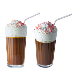 Cappuccino coffee with whipped cream in a tall glass. A tube for a cocktail. Cream confectionery. Isolate on a white background. The photo.