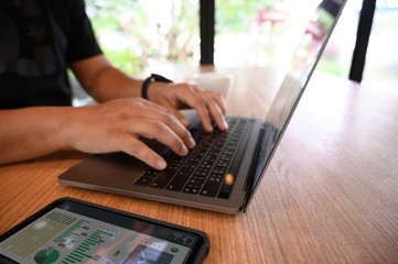 man using a computer to work Laptop, Computer  Desktop PC  Human Hand on Office