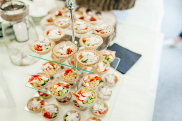 Luxury food and drinks on corporate party table.