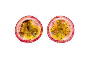 Macro image of two passion fruit sliced halfs isolated at white background.