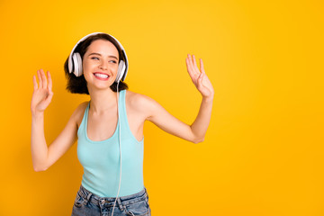 Photo of energetic nice cute amazing encouraged girlfriend dancing during her trip abroad while isolated with yellow background