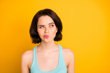 Photo of nice cute cunning sly girl serious pondering over something while isolated with yellow...