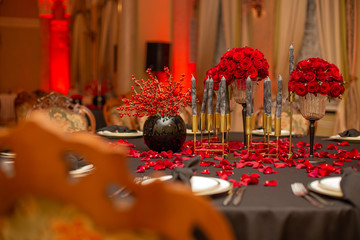 interior festive table evening dinner candlelight red