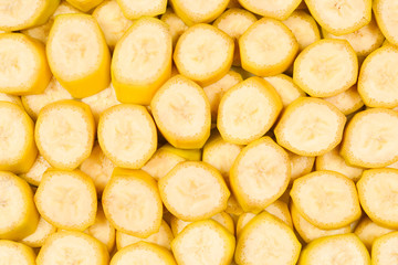 Fresh banana slices background. Top view.