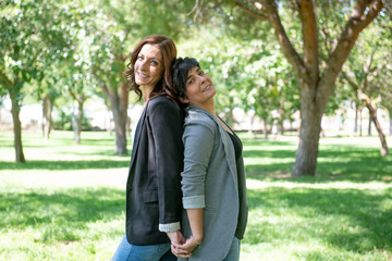Fototapeta premium Lesbian women posing in the park