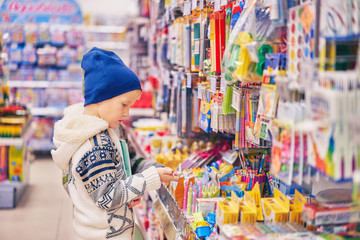 children near the store counter. boys in the supermarket.