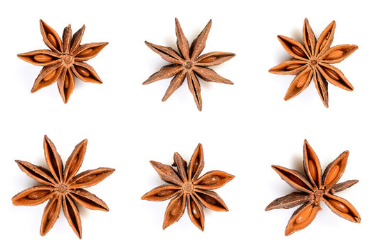 Star anise. Set of six star anise fruits. Closeup Isolated on white background with shadow, top view of chinese badiane spice or Illicium verum.