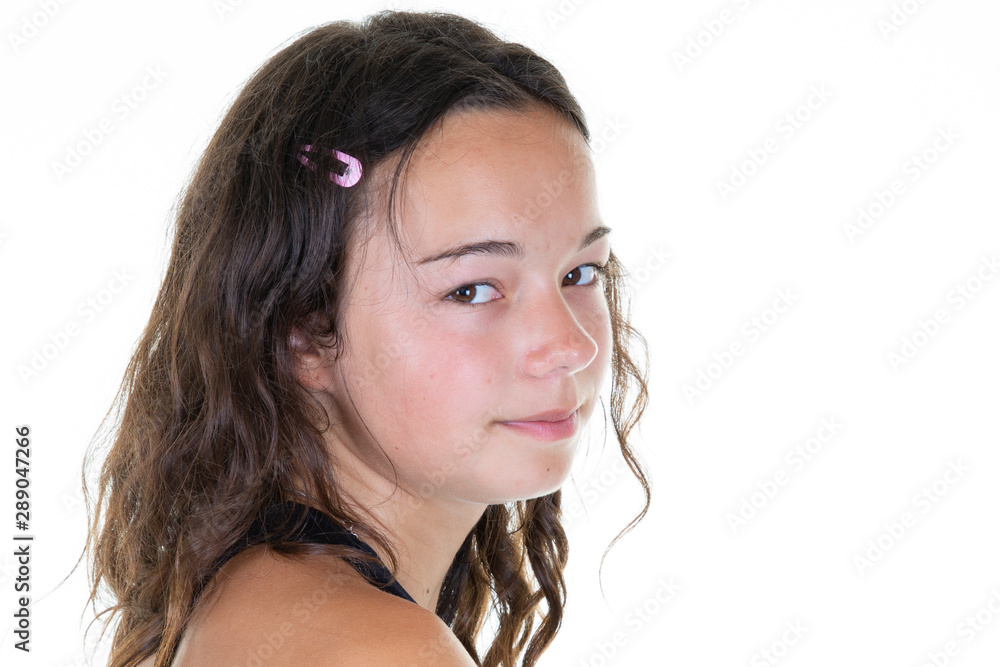 Wall mural Portrait of young beautiful woman in studio look aside back