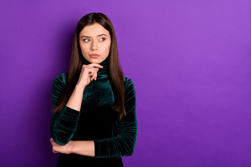 Fototapeta premium Portrait of focused lady touching her chin lookinh having thoughts wearing black turtleneck isolated over purple violet background