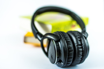 headphones and books isolated on white background