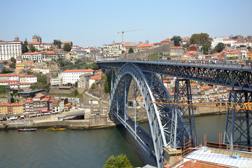 Fototapeta na wymiar Ponte Luís I of Porto city during summer, august 2015 19th. The bridge was constructed by the engineer Théophile Seyrig between 1881 and 1886. He was a disciple of Gustave Eiffel. 
