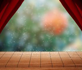 Empty wooden table with Red curtain, blur christmas tree and snow falling background bokeh.