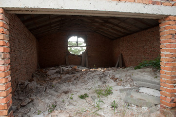 Abandoned room with window at the attic