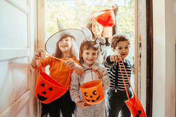 Children in Halloween costumes, trick or treating 