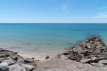 Fototapeta na wymiar anti-erosion systems breakwater riprap and piles in Vendee Ile de Noirmoutier in France