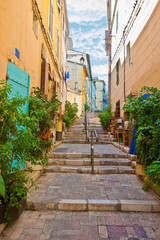 Fototapeta na wymiar Traditional alleys and streets of Marseiller with an old stone staircase (Europe - Provence - France)