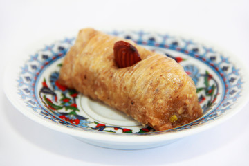 traditional oriental arabic turkish sweet baklava with nuts on a decorative plate