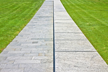New paving made with stone blocks in a pedestrian zone and fresh