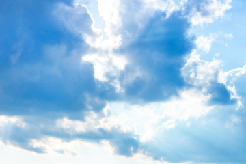 Obraz premium Beautiful gloomy blue sky with fluffy clouds in summer morning peace day as a background. Gray, white and turquoise color blured skyline photography