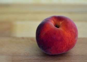 peach on wooden table
