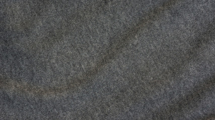 Close up of dark gray soft fabric for a background.