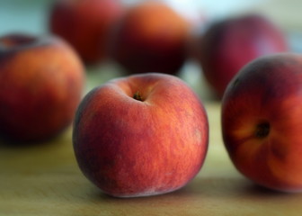 peaches on wooden table