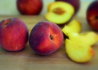 Fototapeta na wymiar Peaches on wooden table