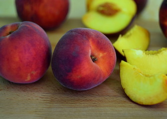 Fototapeta na wymiar Peaches on wooden table