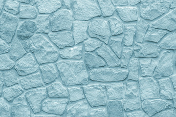 Cobblestones wall, gray background. Light blue texture of stone wall. Masonry rough surface, modern design. Grey bricks, natural pattern. Abstract architecture backgrounds.