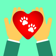 Heart with the image of paw prints. Heart in hands. Logo for pet shop or for veterinary clinic.