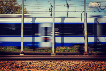 Speeding Train on suburban rails