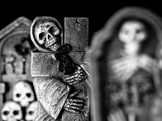 Spooky Graveyard with Skeleton Tombstones - Black and White