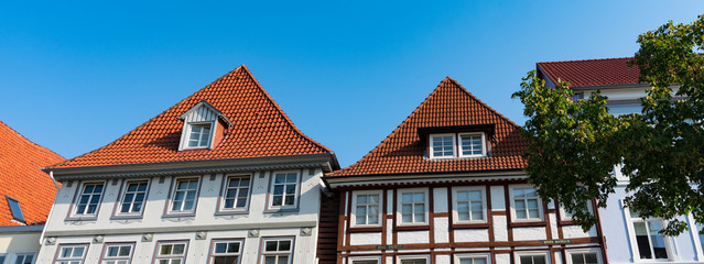 White half timbered houses with orange roof tiles in Hameln, Germany